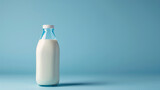 White milk product in the glass bottle mockup. Blue background.