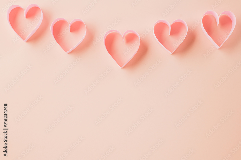 Happy Valentines Day. Above pink ribbon heart shaped decorative symbol isolated on pastel pink background, love romance concept, template banner design with copy space, Mother, Woman day