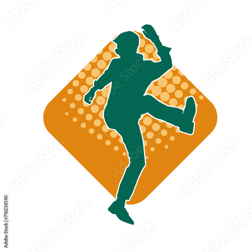 Silhouette of a slim man dancing pose. Silhouette of a male dancer in action pose.