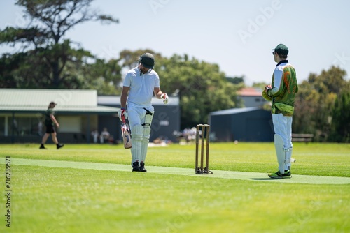 playing a game on a green over for health and recreation in australia in summer