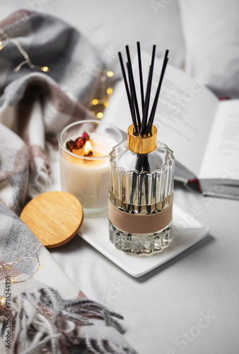 Cozy home atmosphere. Home liquid fragrance in glass bottle