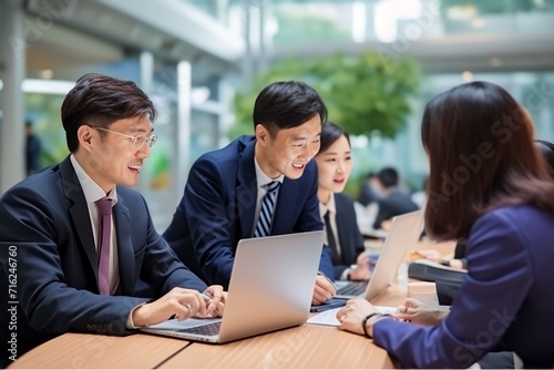 Group of Chinese people working at the office