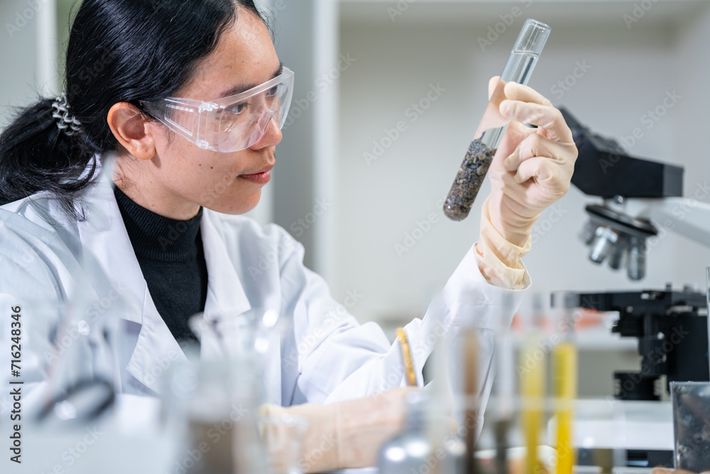 © chokniti - Ground researcher, geologist or archaeologist working with test tube of soil, rock, stone or fossil sample studying, finding or discovering in paleontology, archaeological and geological or laboratory © chokniti - Ground researcher, geologist or archaeologist working with test tube of soil, rock, stone or fossil sample studying, finding or discovering in paleontology, archaeological and geological or laboratory