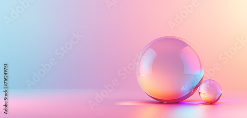 Glass spheres reflecting soft light on a pastel gradient.