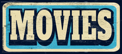 aged and worn movies sign on wood