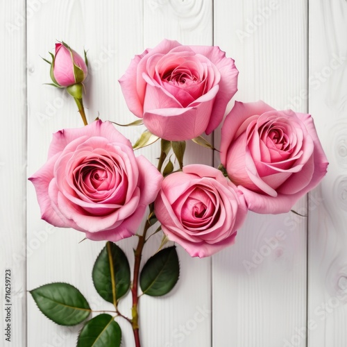 Flowers of pink roses on white wood background. Happy Valentine s Day with this romantic greeting card.