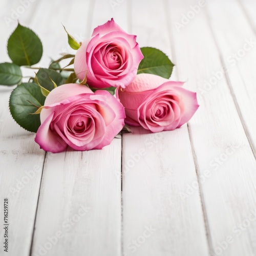 Flowers of pink roses on white wood background. Happy Valentine s Day with this romantic greeting card.