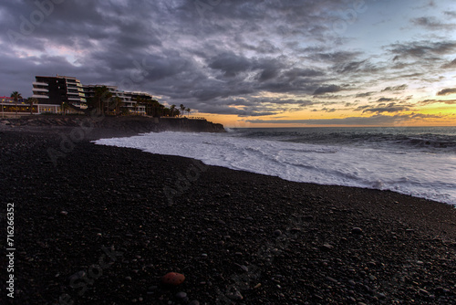 Atmospheric sunset at the Beach in Puerto de Naos on La Palma (Spain) photo