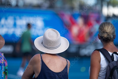 australian open crowds watching tennis matches on a hot summer day photo