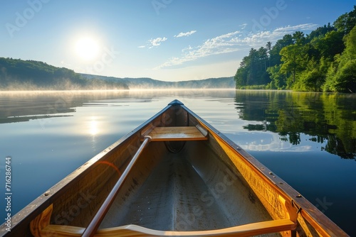 Bow of a canoe on a lake, sunny morning
