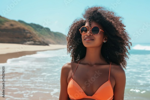 Radiant Bikini-Clad African American Woman Embodies Beachside Style On A Sunny Day
