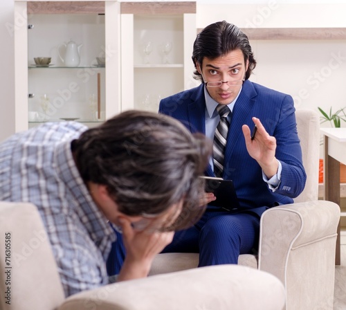 Young male patient discussing with psychologist personal problem