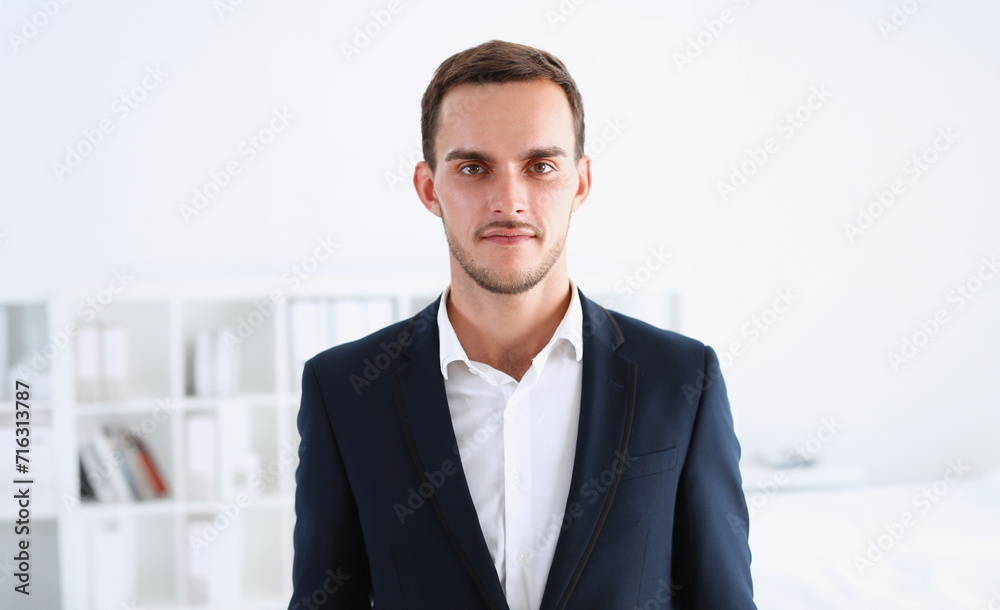 Handsome man in suit and tie look in camera hands crossed on chest background. White collar dress code modern office lifestyle graduate college study profession idea coach train concept Handsome man in suit and tie look in camera hands crossed on chest background. White collar dress code modern office lifestyle graduate college study profession idea coach train concept