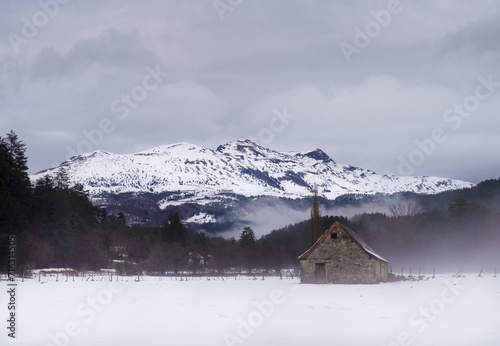 Roncal Valley. Cabin with snowfall in the Roncal Valley, Lakora in the background, Navarre.