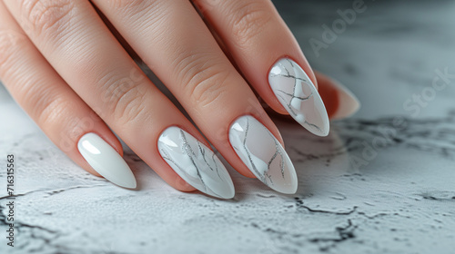 Woman hand with marble pattern nail polish on her fingernails. White color nail manicure with gel polish at luxury beauty salon. Nail art and design. Female hand model, Ai generated image