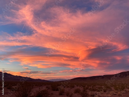 Tufty pink clouds in big sky