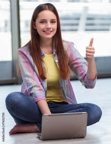Young girl surfing internet on laptop Free Download Young girl surfing internet on laptop - GFXLoad