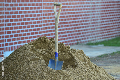 sand and shovel in construction site