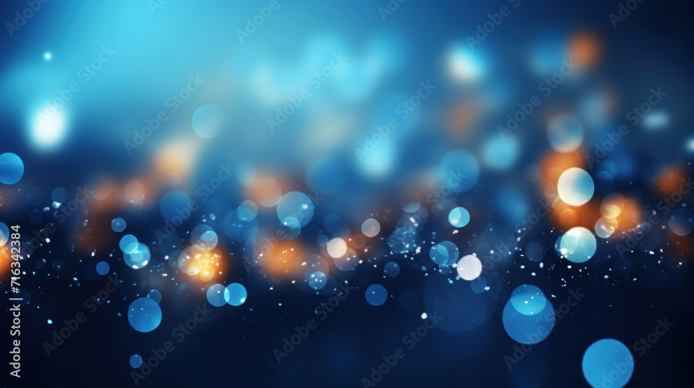 Glowing abstract bokeh light particles on a blue background.