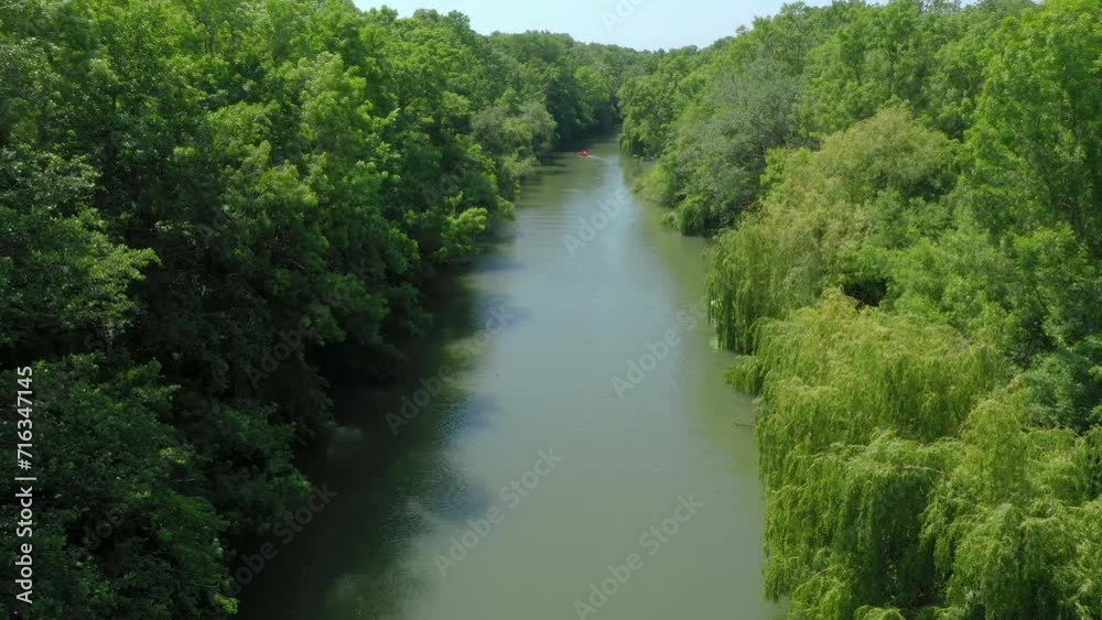 Beautiful view of Kamchiya river and tropical rainforest in summer day. The drone is flying on the river. Aerial landscape. Stock footage. Picturesque view from above of Bulgarian nature Beautiful view of Kamchiya river and tropical rainforest in summer day. The drone is flying on the river. Aerial landscape. Stock footage. Picturesque view from above of Bulgarian nature
