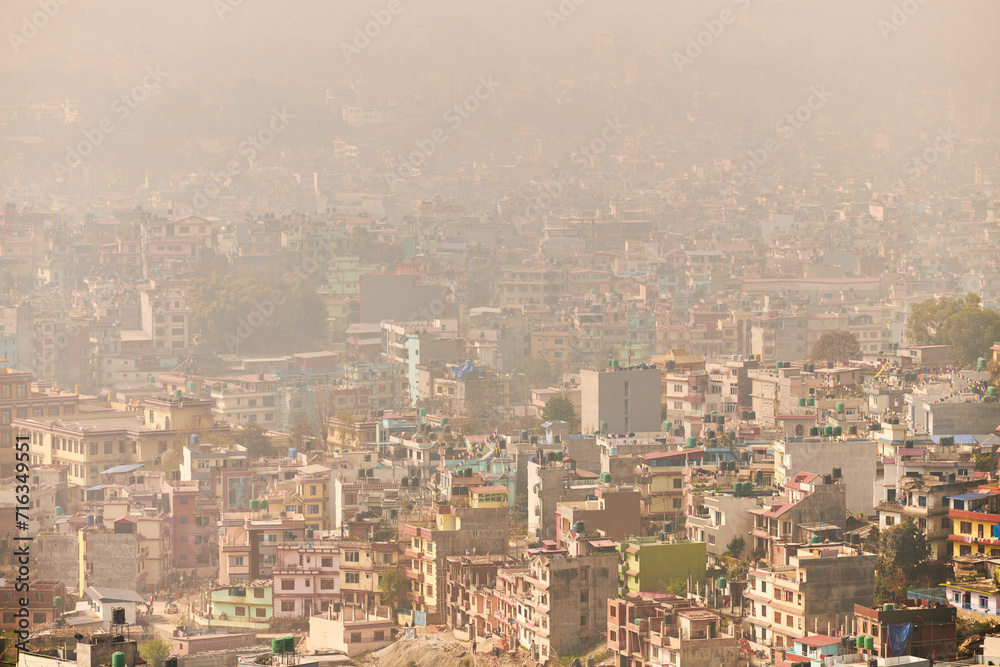 View of Kathmandu capital of Nepal from mountain through urban haze with lot of low rise buildings