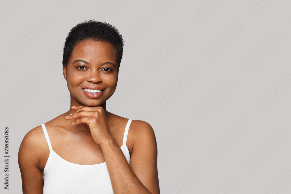 Cheerful smiling woman with healthy fresh clean skin on white background. Facial treatment, skin care and cosmetology concept Cheerful smiling woman with healthy fresh clean skin on white background. Facial treatment, skin care and cosmetology concept
