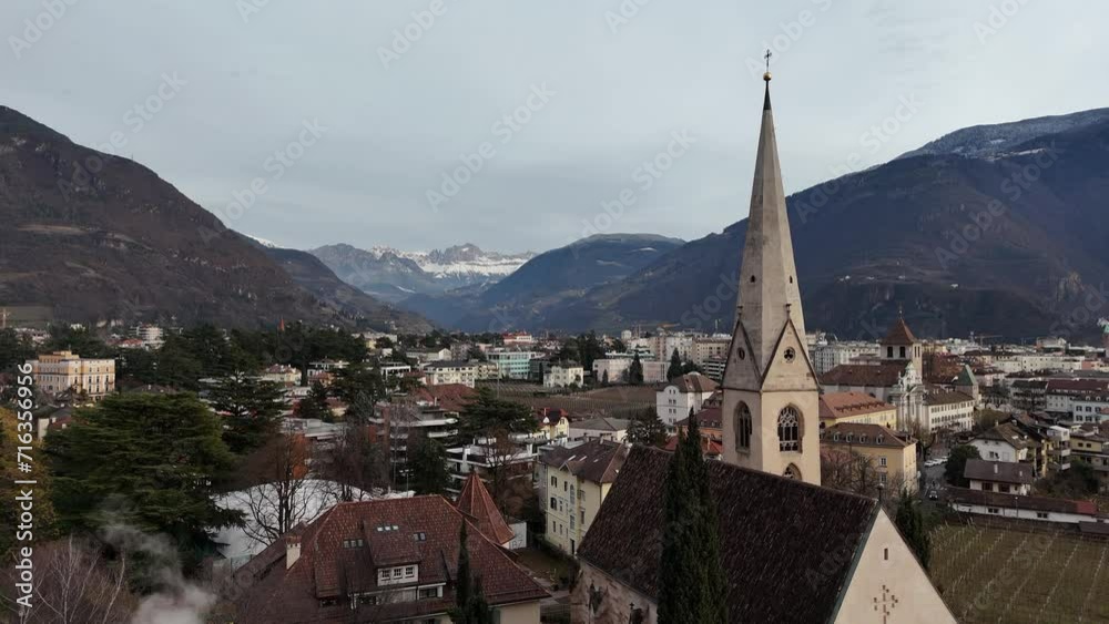 The evening city of Bolzano shot from a drone. The evening city of Bolzano shot from a drone.