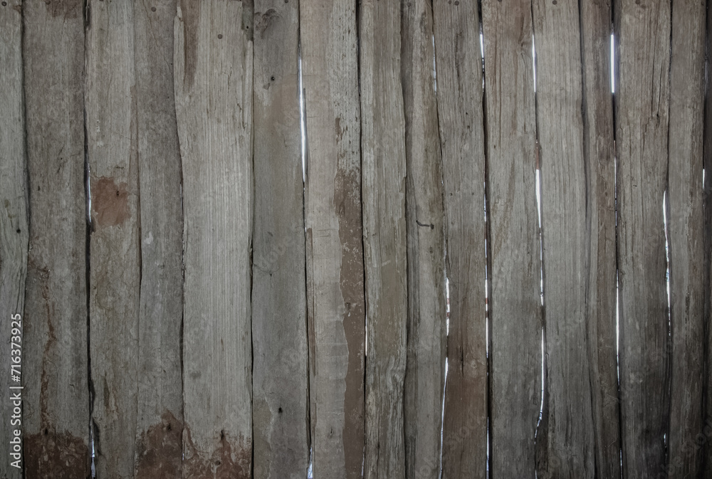 Wood plank brown texture background surface with old natural pattern. Barn wooden wall antique cracking furniture weathered rustic vintage peeling wallpaper. Summer organic decoration with hardwood. Wood plank brown texture background surface with old natural pattern. Barn wooden wall antique cracking furniture weathered rustic vintage peeling wallpaper. Summer organic decoration with hardwood.