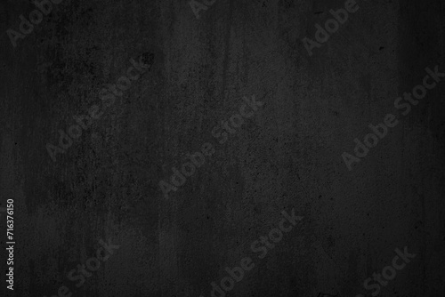 Black dark concrete wall background. Pattern board cement texture grunge dirty scratched for show anthracite promote product urban floor and abstract paper design element decor. Blackboard blank.