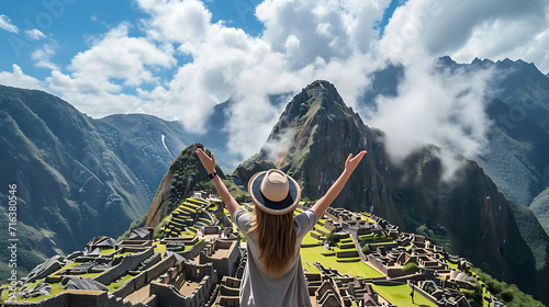Tourists raising their hands happy to arrive at Machu Picchu, Peru, wonders of the world, world travel concept photo