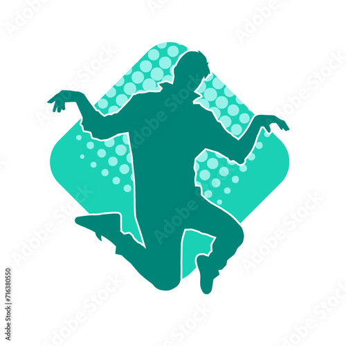 Silhouette of a slim man dancing pose. Silhouette of a male dancer in action pose.