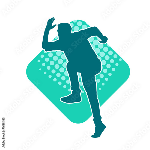 Silhouette of a slim man dancing pose. Silhouette of a male dancer in action pose.