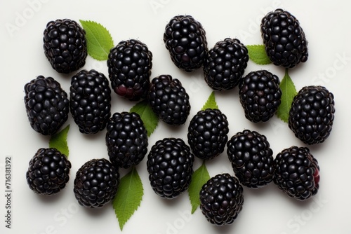 Fresh Blackberries with Green Leaves on White Background