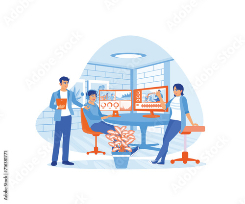 Colleagues are discussing film recording with the video editor in the creative start up agency office. Process film montages with post-production software. Video Editor concept. 