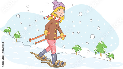 Child girl walking on snowshoes in the snow.