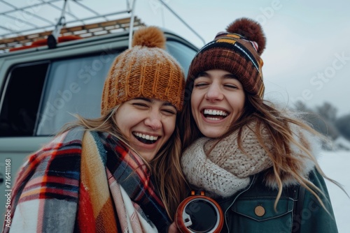 Two women standing next to each other in the snow. Perfect for winter-themed projects