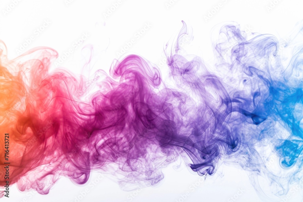 Colorful smoke is captured in the air against a plain white background. This versatile image can be used for various purposes