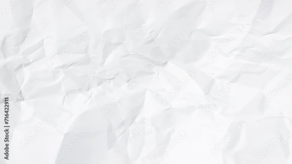 Time-lapse of rapidly changing texture of a white crumpled paper.