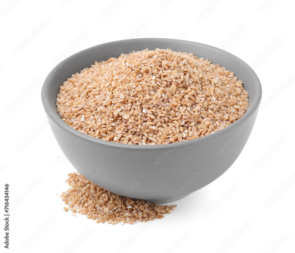 Dry wheat groats in bowl isolated on white Dry wheat groats in bowl isolated on white