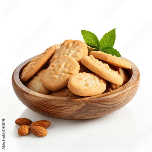 Freshly baked Almond cookies in a bowl on white background