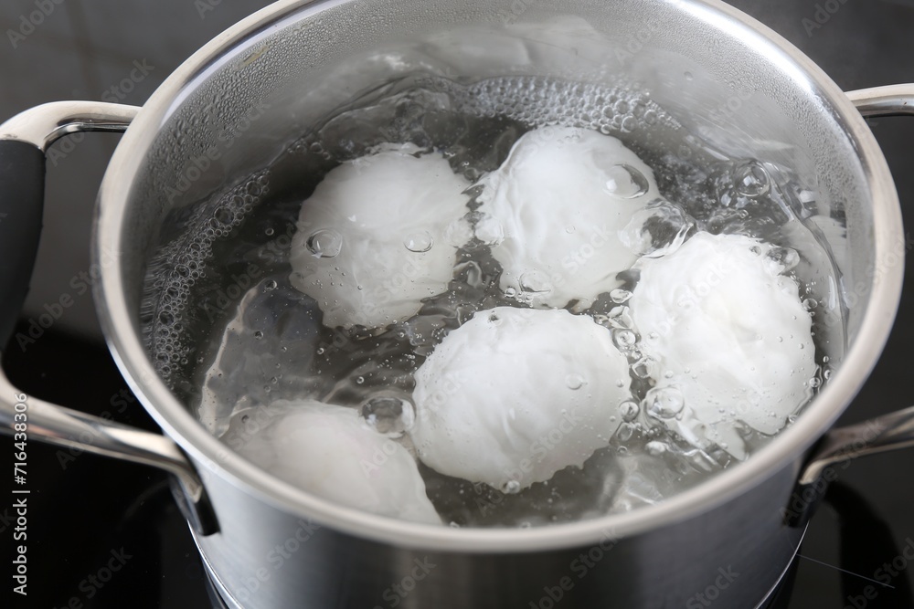 Chicken eggs boiling in pot on electric stove, closeup Chicken eggs boiling in pot on electric stove, closeup