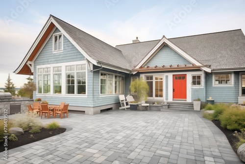 coastal home with cedar shingles and gray stone base