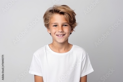 Portrait of a smiling boy in a white t-shirt