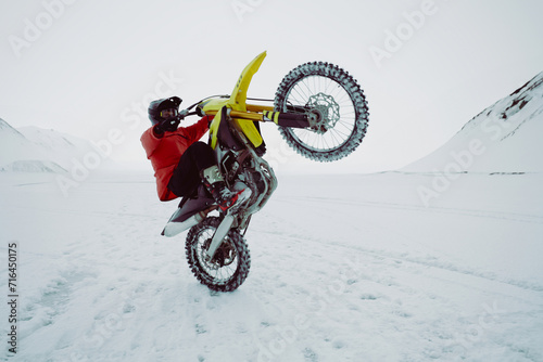 Fototapeta Naklejka Na Ścianę i Meble -  Winter motocross. Racers ride on ice. Winter sports.