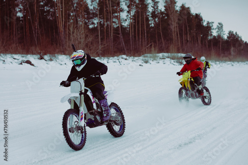 Winter motocross. Racers ride on ice. Winter sports.