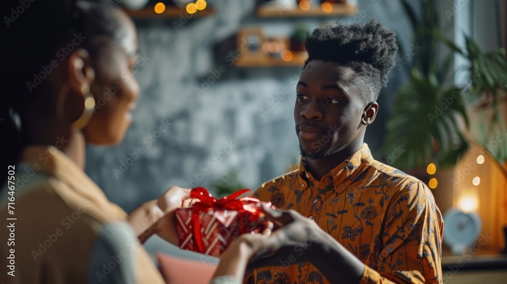 Loving african american man hugging his wife, giving gift box, making ...