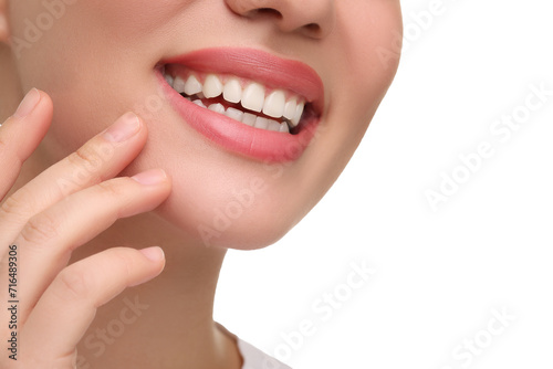 Woman with clean teeth smiling on white background, closeup