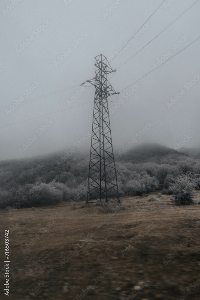 post-soviet electrical tower in icy landscape post-soviet electrical tower in icy landscape