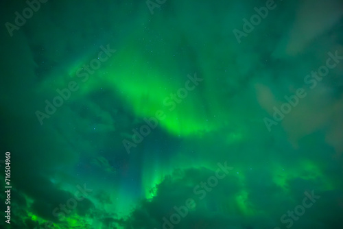 Northern lights between the Clouds  Aurora Borealis