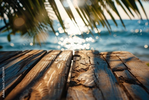 A wooden terrace with palm shadows, ocean views, and a sunlit atmosphere, ideal for relaxation.